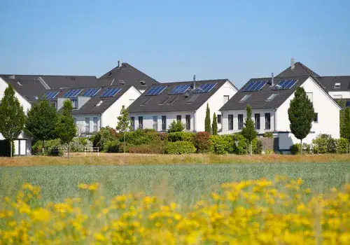 contemporary white family houses with solar panels picture id1241450911.jpg