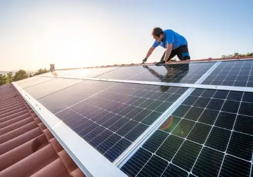 professional worker installing solar panels on the roof of a house picture id1312981460.jpg